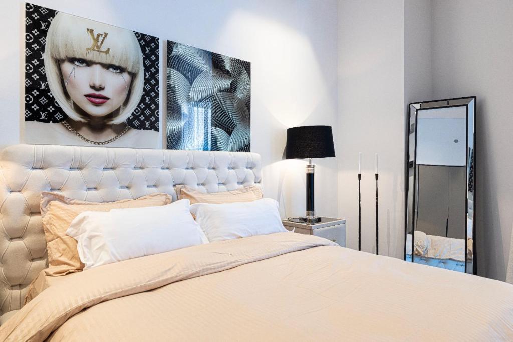 Bedroom from another angle with bedside lamps and pop-art wall
