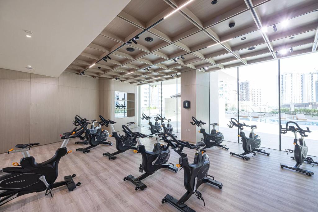 Spinning studio lined with Matrix cycling bikes and city views